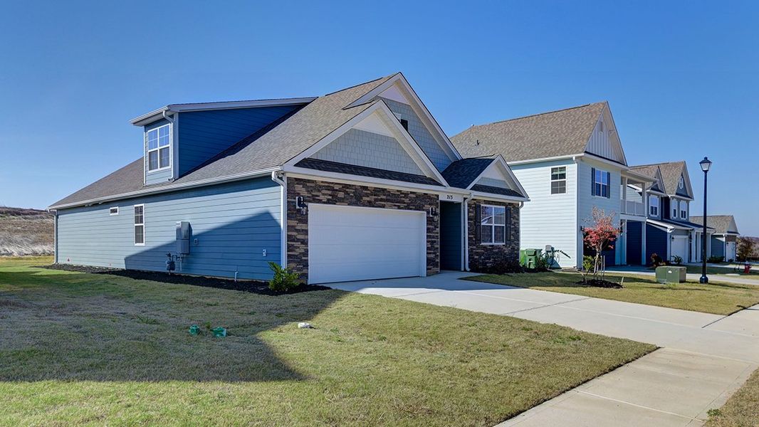 Front exterior of a new home in Livingston Woods, Irmo, SC, highlighting curb appeal (Image 23).