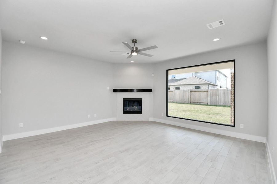 Take another glimpse into the heart of the home with this additional view of the family room—a sprawling space ready to accommodate all your gatherings. Take another glimpse into the heart of the home with this additional view of the family room—a sprawling space ready to accommodate all your gatherings.