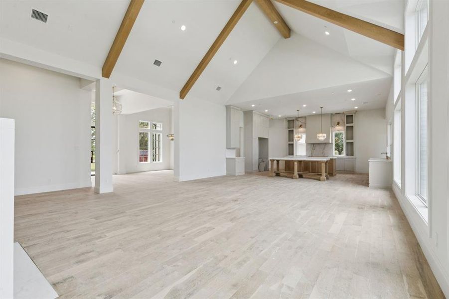 The grand living room flows seamlessly to your gourmet kitchen.