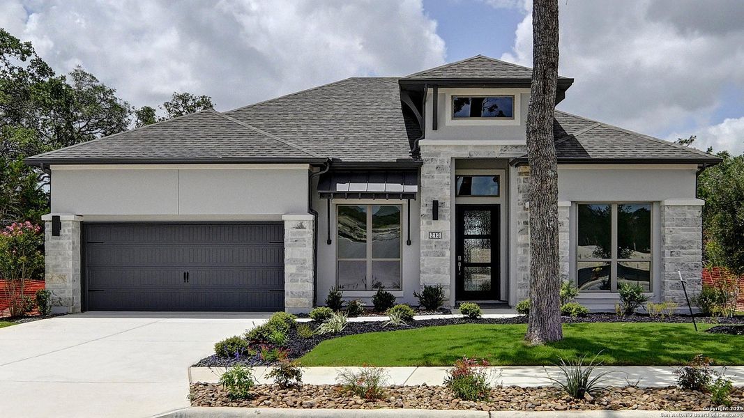 Front exterior of a new home in Esperanza 60', Boerne, TX, highlighting curb appeal (Image 25).