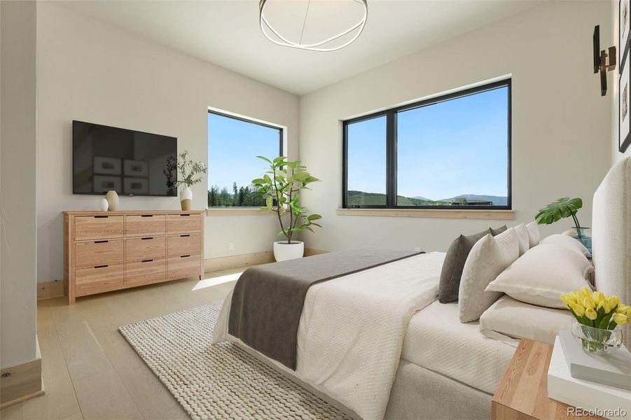 Main floor primary bedroom digitally staged