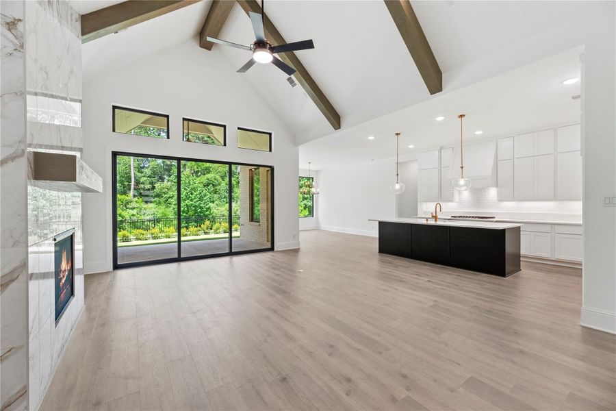 Open living space that seamlessly flows into the designer kitchen and dining area.