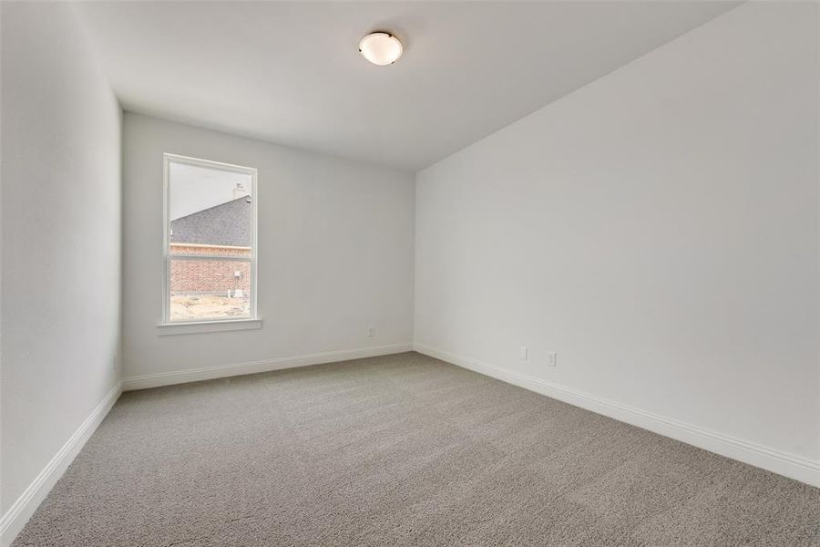 Empty room with carpet floors