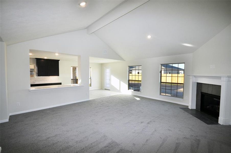 Soaring ceiling and a remotely controlled, directly vented gas fireplace.  Even has a battery operated igniter in case the weather knocks out the power.