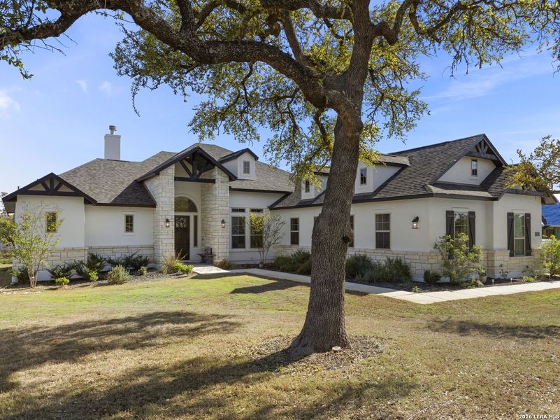 Front exterior of a new home in Potranco Acres, Castroville, TX, highlighting curb appeal (Image 23).