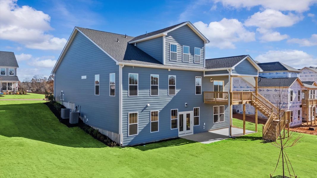 Tasteful rear porch provides a peaceful retreat and effortless indoor-outdoor flow