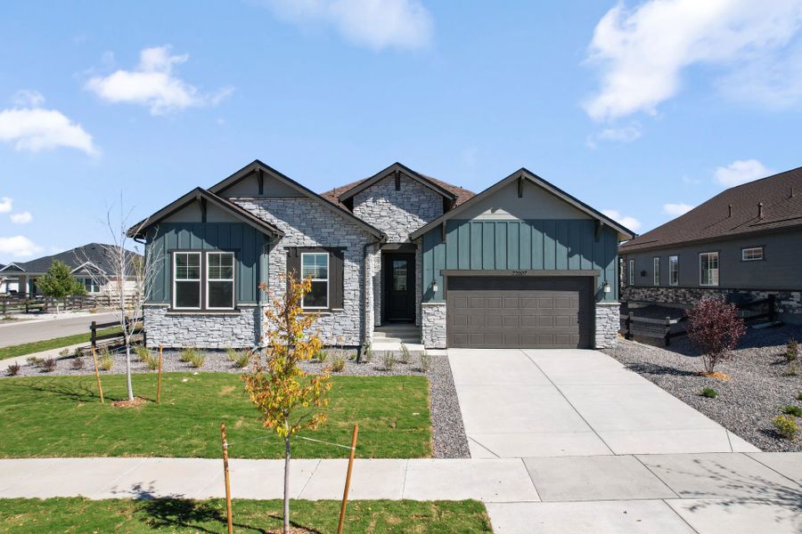Front exterior of a new home in Hilltop at Inspiration, Aurora, CO, highlighting curb appeal (Image 2). Front exterior of a new home in Hilltop at Inspiration, Aurora, CO, highlighting curb appeal (Image 2).