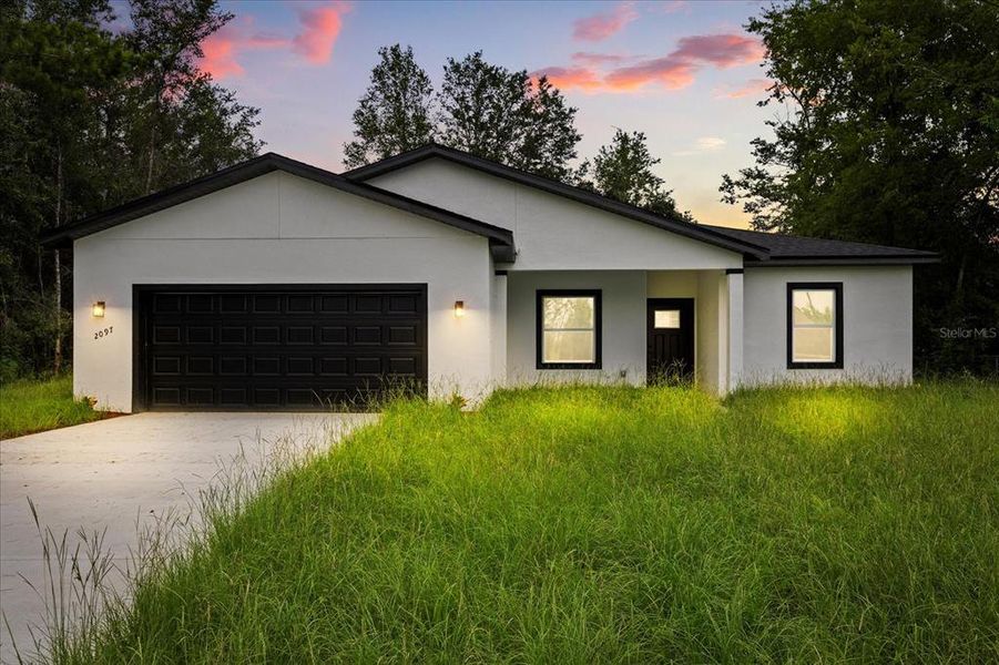 Front exterior of a new home in , Ocala, FL, highlighting curb appeal (Image 22). Front exterior of a new home in , Ocala, FL, highlighting curb appeal (Image 22).