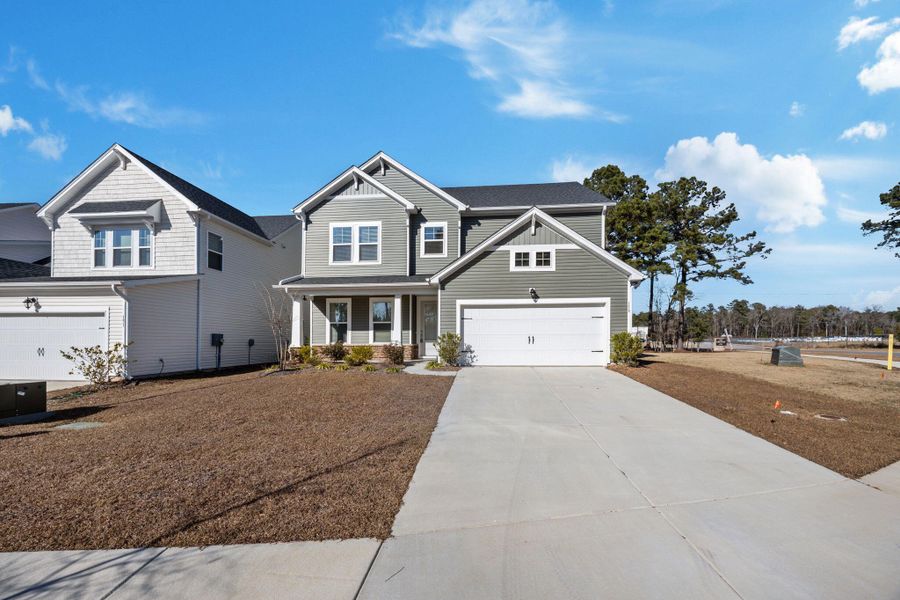 Front exterior of a new home in The Groves of Berkeley, Moncks Corner, SC, highlighting curb appeal (Image 29).