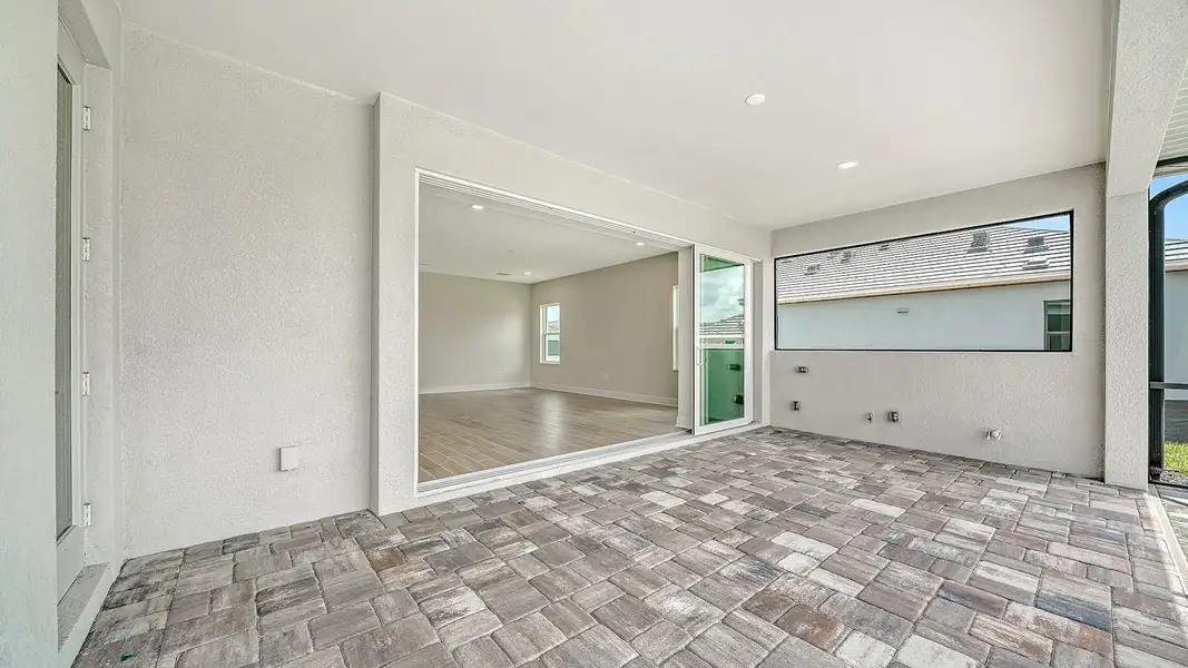 Spacious, unfurnished interior of a new home in Palm Grove Real Estate and Homes for Sale in Lakewood Ranch, FL - Neal Communities, Bradenton (Image 12).