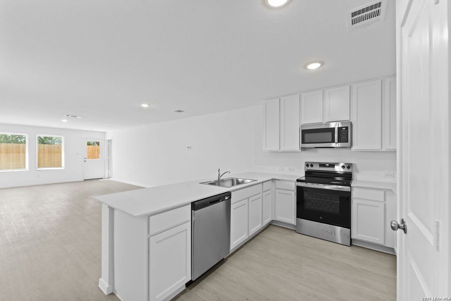 Furnished interior view inside a new home in Guadalupe Ridge, New Braunfels (Image 9).
