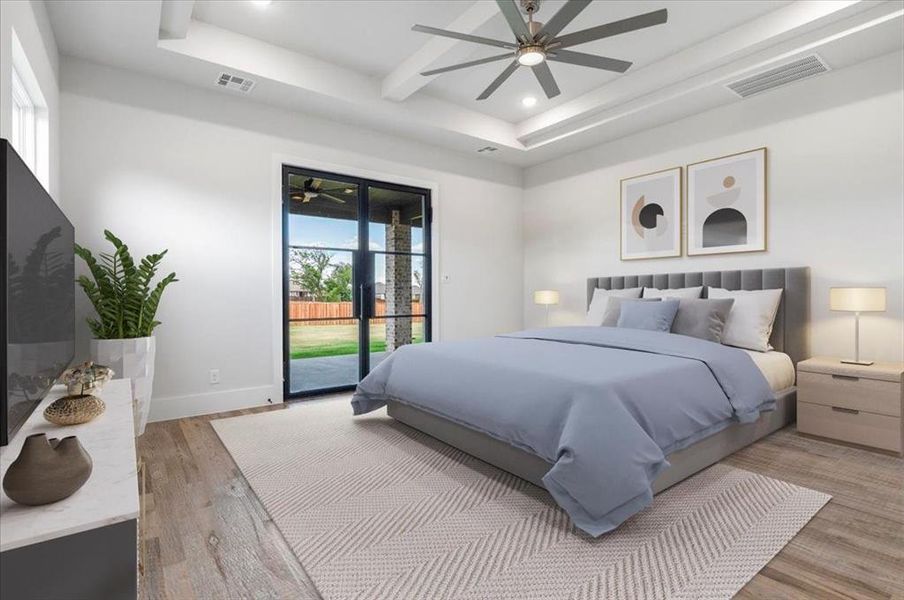 Bedroom featuring access to outside, a tray ceiling, wood-type flooring, and ceiling fan