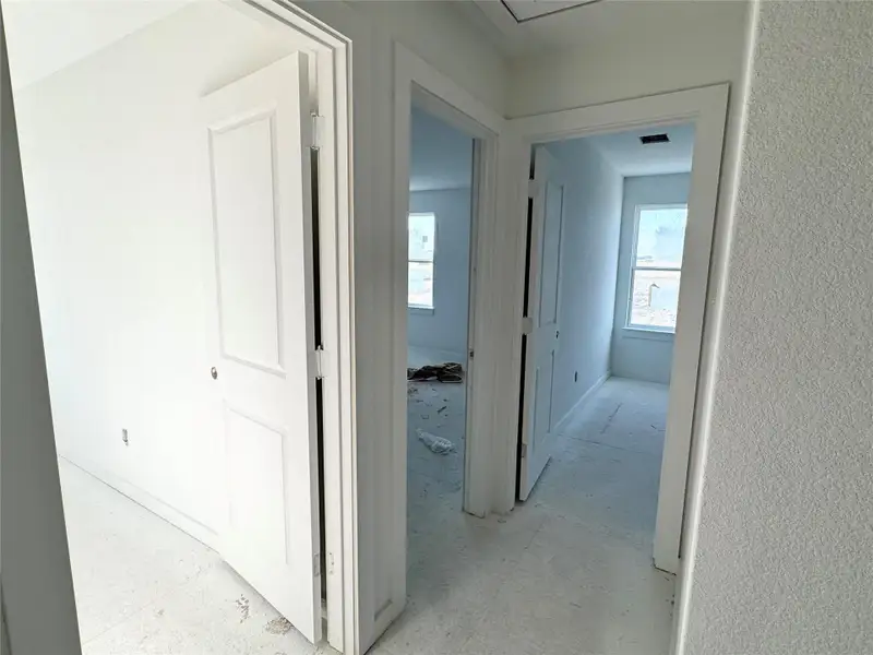 Hallway featuring baseboards Hallway featuring baseboards