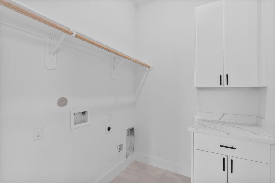 Thoughtfully designed utility room with custom storage cabinetry Thoughtfully designed utility room with custom storage cabinetry