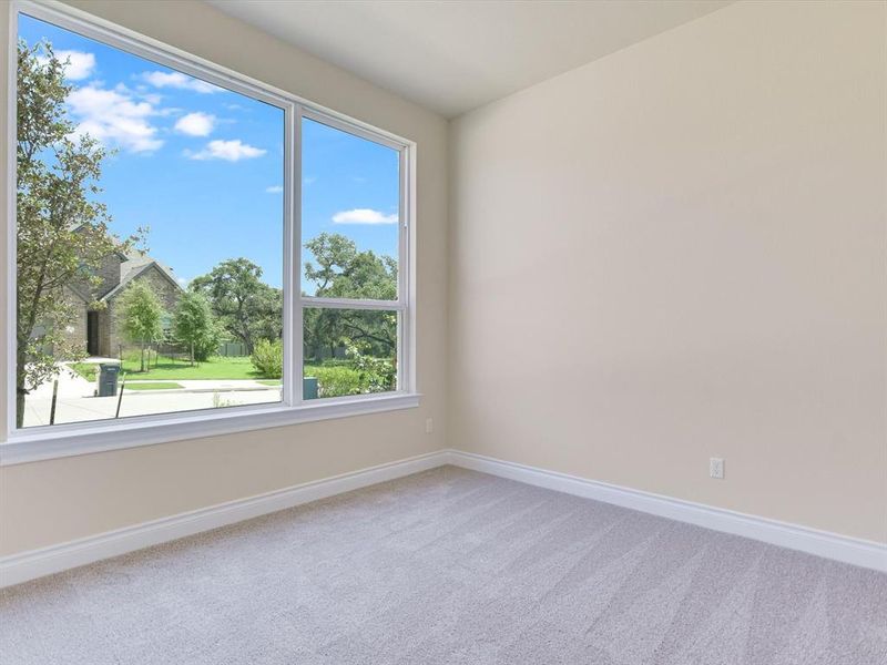 Bedroom #1 features a beautiful picture window offering abundant natural light.