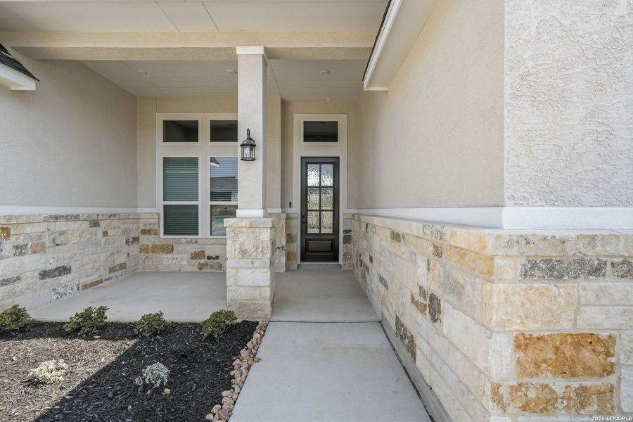 Exterior details and patio area of a home in Potranco Oaks, Castroville (Image 28).