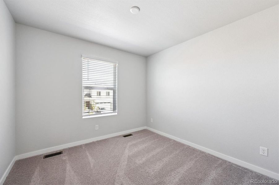 Spacious, unfurnished interior of a new home in Legato, Commerce City (Image 24).