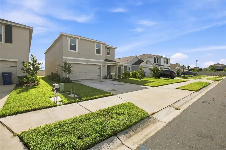 Front exterior of a new home in Silverstone North, Palmetto, FL, highlighting curb appeal (Image 2). Front exterior of a new home in Silverstone North, Palmetto, FL, highlighting curb appeal (Image 2).