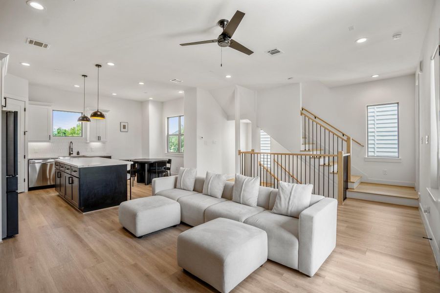 This expansive, open-plan space combines the living room, kitchen, and dining area—ideal for entertaining. With a sleek kitchen island at its heart, it offers effortless flow between cooking, dining, and lounging, so you can host dinner parties or casual get-togethers without missing a moment.