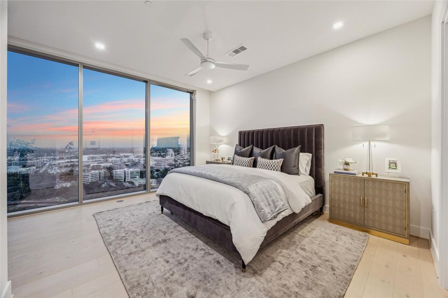 Bright, freshly painted primary suite with expansive floor-to-ceiling windows. Bright, freshly painted primary suite with expansive floor-to-ceiling windows.
