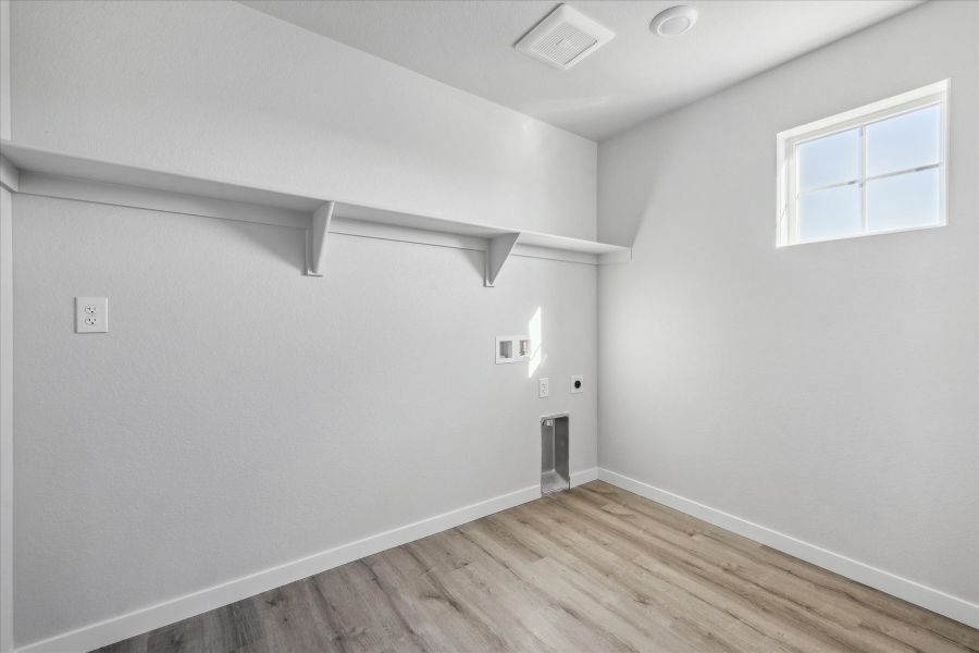 A room with a wood floor and white walls. A room with a wood floor and white walls.