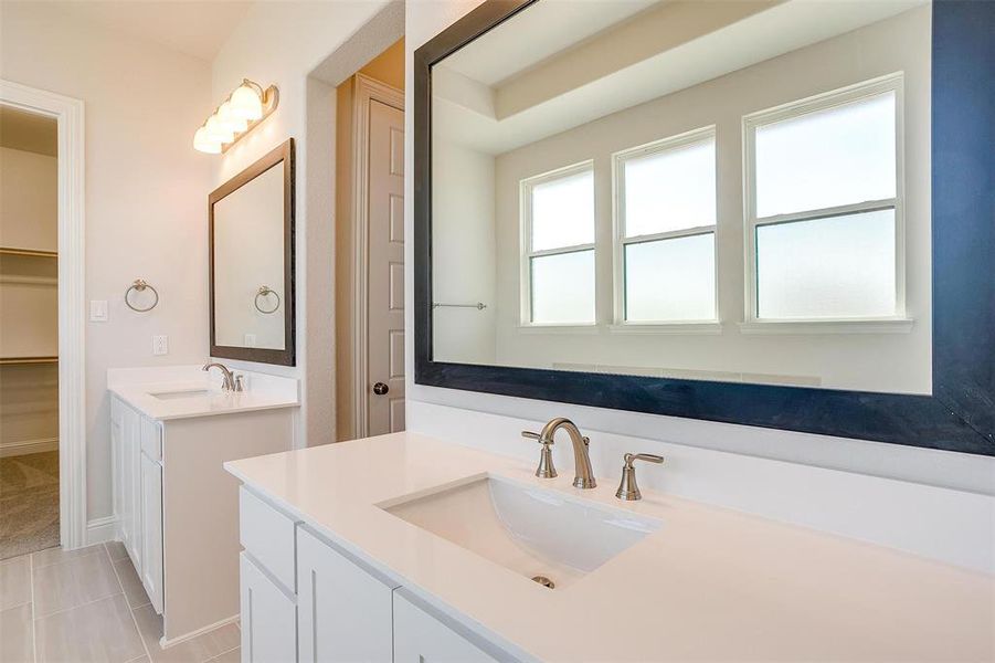 Bathroom with vanity and tile patterned floors