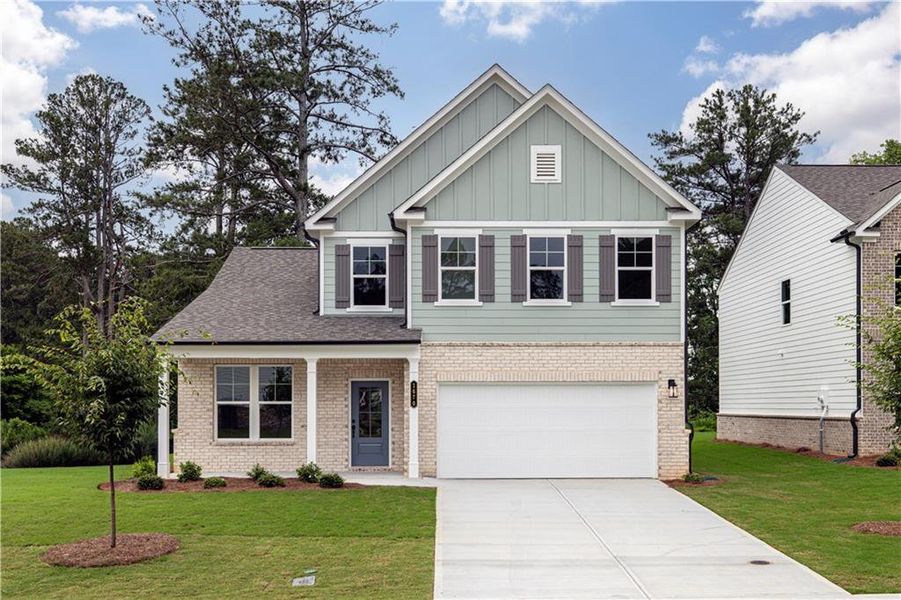 Front exterior of a new home in Riverside Ridge, Lawrenceville, GA, highlighting curb appeal (Image 21).