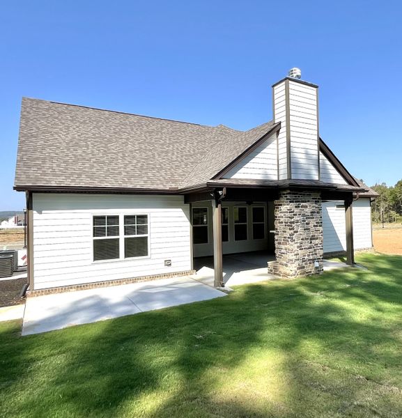 Large covered back porch and extra concrete for gilling and lounging