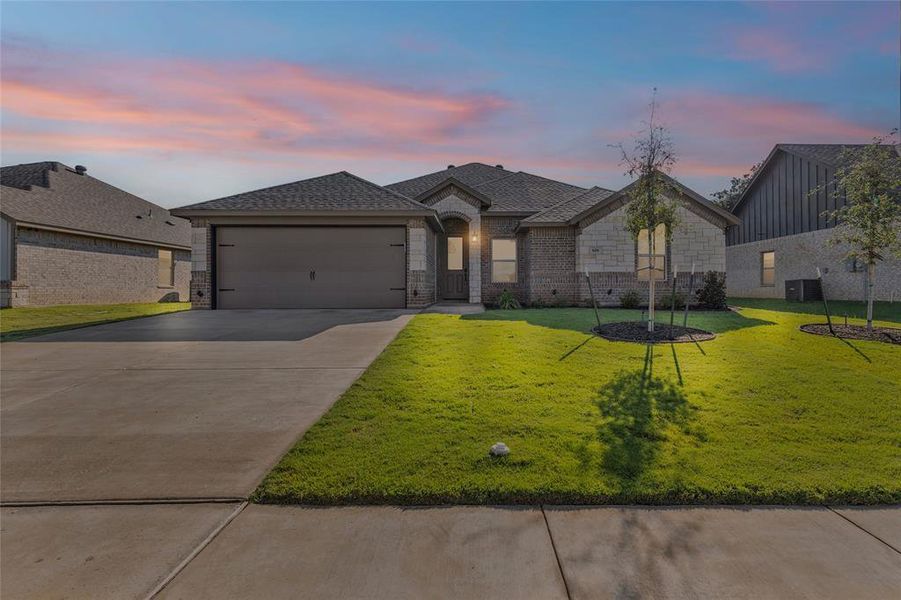 Front exterior of a new home in , Springtown, TX, highlighting curb appeal (Image 20).