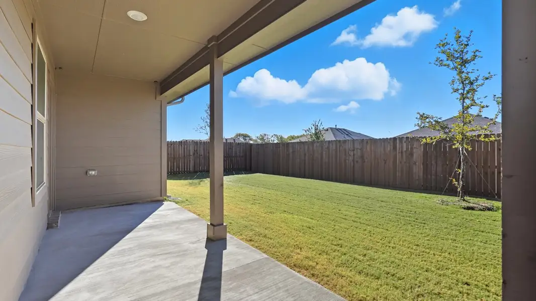 Exterior details and patio area of a home in Eagle Creek, Denton (Image 2).