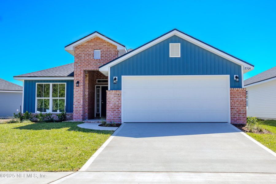 Front exterior of a new home in Summerglen, Jacksonville, FL, highlighting curb appeal (Image 13).
