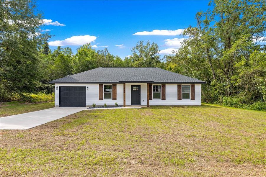 Front exterior of a new home in , Ocala, FL, highlighting curb appeal (Image 20). Front exterior of a new home in , Ocala, FL, highlighting curb appeal (Image 20).