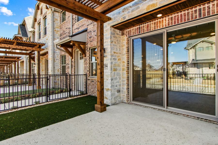 Exterior details and patio area of a home in The Tribute, The Colony (Image 28).