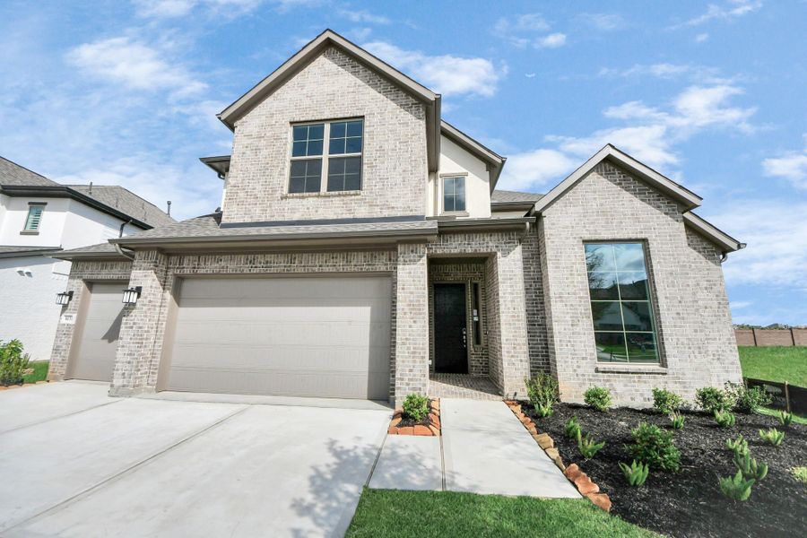 Front exterior of a new home in Marvida, Cypress, TX, highlighting curb appeal (Image 22).