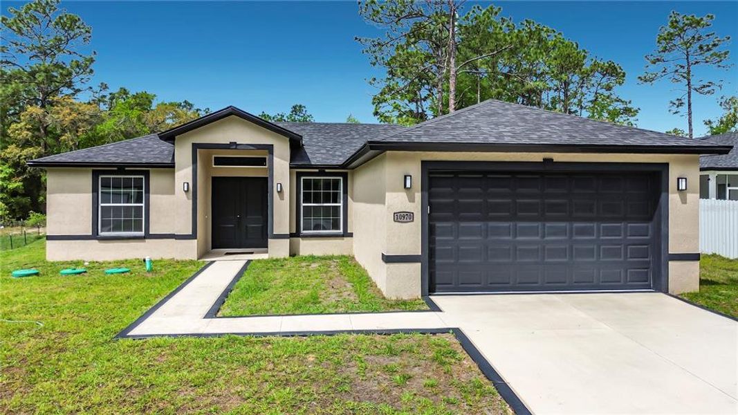 Front exterior of a new home in , Citrus Springs, FL, highlighting curb appeal (Image 21).