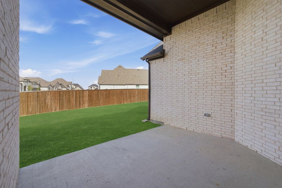Exterior details and patio area of a home in Sonoma Verde, Heath (Image 24).