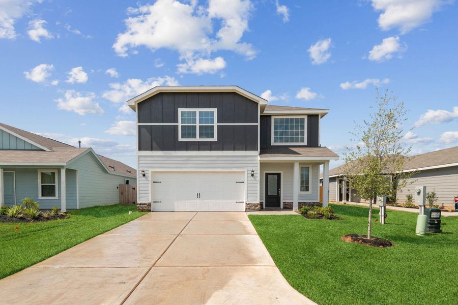 Front exterior of a new home in Sweetwater Ridge, Conroe, TX, highlighting curb appeal (Image 1). Front exterior of a new home in Sweetwater Ridge, Conroe, TX, highlighting curb appeal (Image 1).