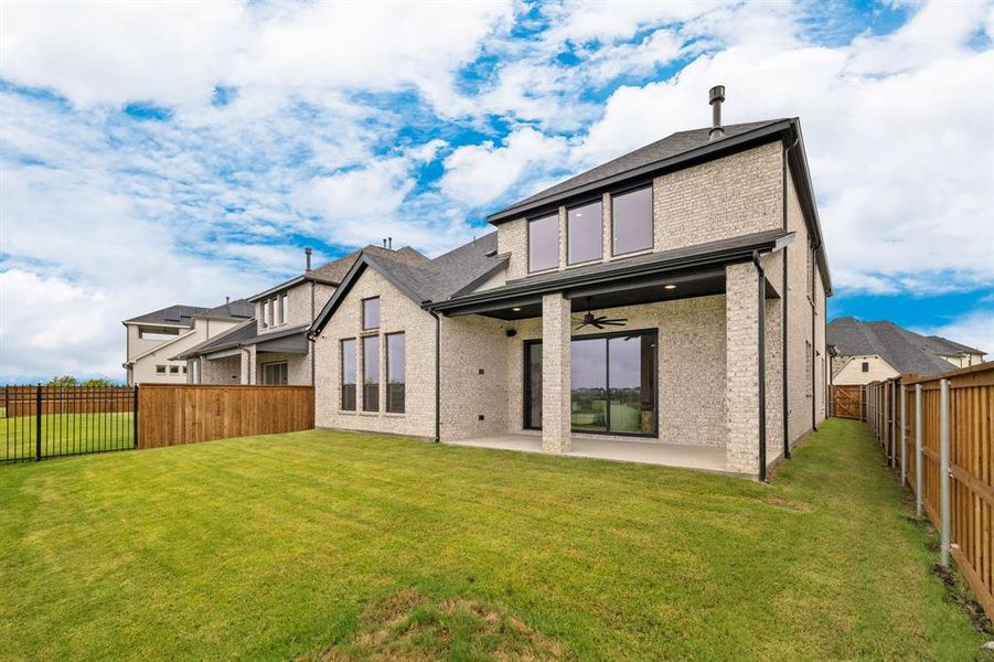 Rear view of property featuring ceiling fan, a fenced backyard, brick siding, a patio area, and a shingled roof Rear view of property featuring ceiling fan, a fenced backyard, brick siding, a patio area, and a shingled roof