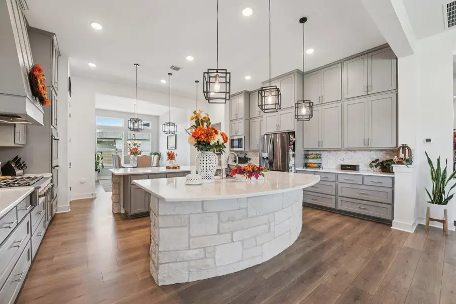 The breakfast bar offers casual seating and serves as the perfect spot for morning coffee or conversation.
