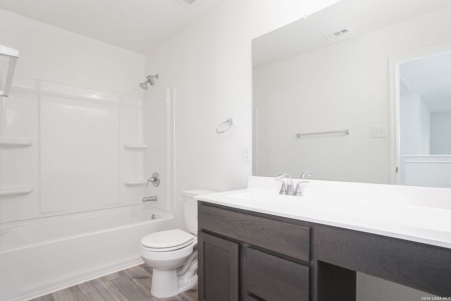 Furnished interior view inside a new home in Parklands, Schertz (Image 11).