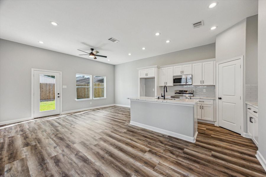 Open Concept Living & Kitchen with Backyard Access Open Concept Living & Kitchen with Backyard Access