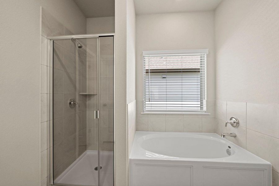 Primary Bath retreat with garden tub & walk-in shower Primary Bath retreat with garden tub & walk-in shower