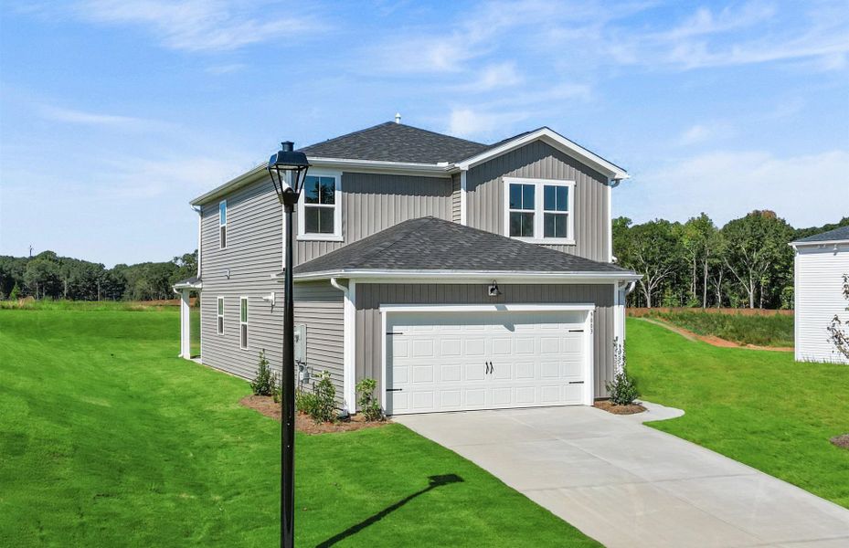 Front exterior of a new home in Crestview, Spartanburg, SC, highlighting curb appeal (Image 1). Front exterior of a new home in Crestview, Spartanburg, SC, highlighting curb appeal (Image 1).