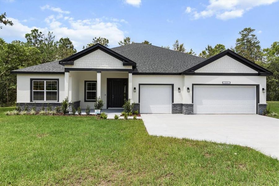 Front exterior of a new home in , Ocala, FL, highlighting curb appeal (Image 2).
