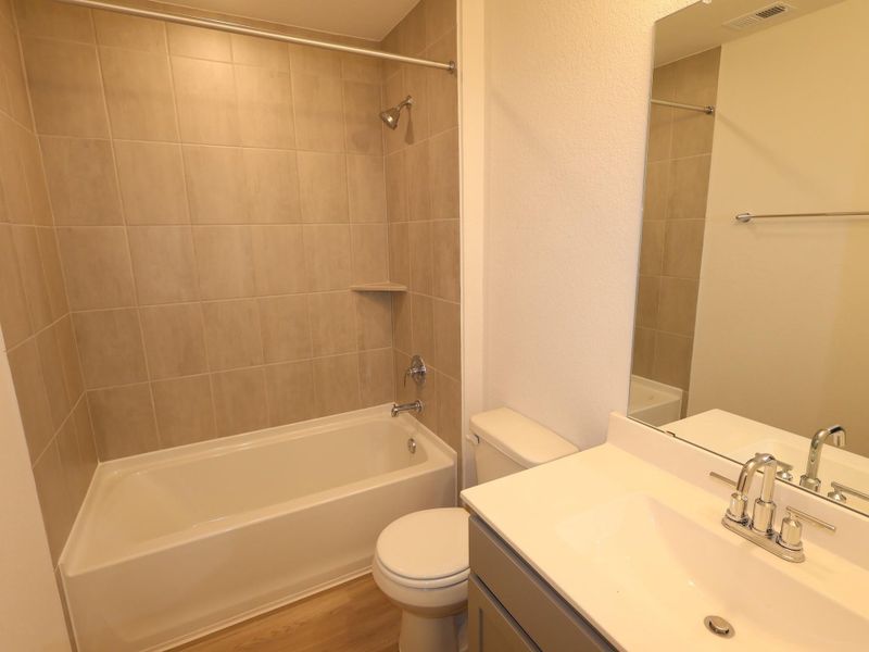 Furnished interior view inside a new home in Sorella, Tomball (Image 7).