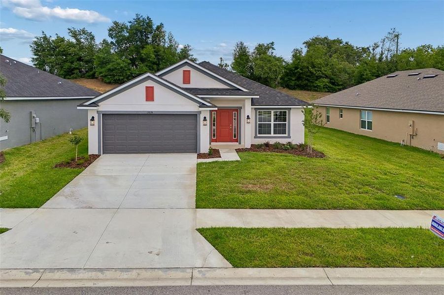 Front exterior of a new home in Abbey Glen, Dade City, FL, highlighting curb appeal (Image 32).