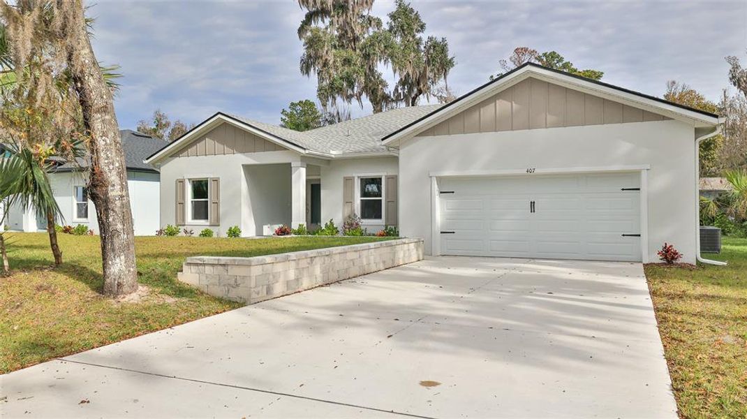 Front exterior of a new home in , New Smyrna Beach, FL, highlighting curb appeal (Image 1). Front exterior of a new home in , New Smyrna Beach, FL, highlighting curb appeal (Image 1).