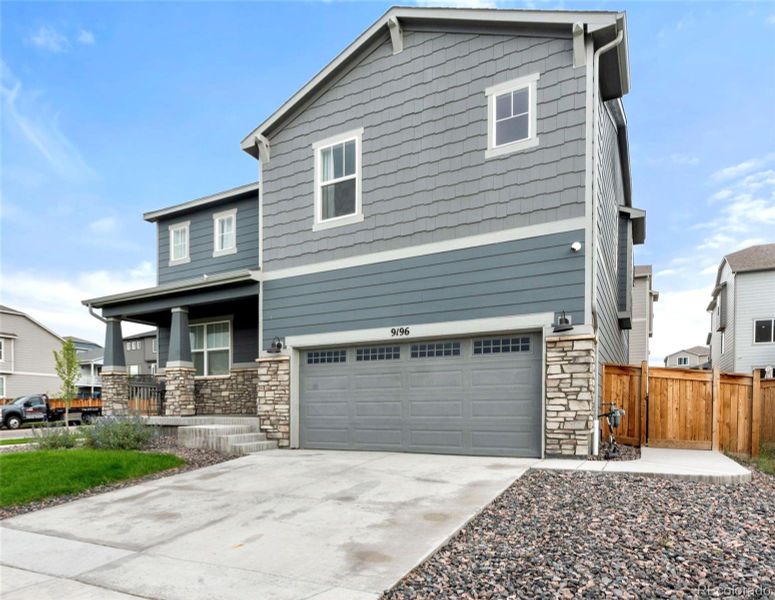Front exterior of a new home in Buffalo Highlands: The Canyon Collection, Commerce City, CO, highlighting curb appeal (Image 18).