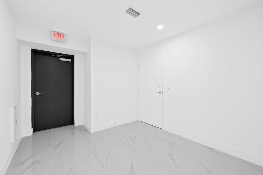 Spacious, unfurnished interior of a new home in Aria Reserve, Miami (Image 36). Spacious, unfurnished interior of a new home in Aria Reserve, Miami (Image 36).