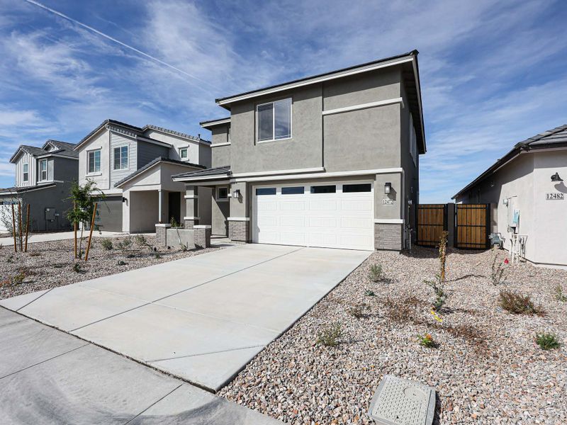 Front exterior of a new home in Teravalis, Buckeye, AZ, highlighting curb appeal (Image 23). Front exterior of a new home in Teravalis, Buckeye, AZ, highlighting curb appeal (Image 23).